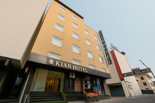 a building with a kaan hotel on the street at Hotel Kian by JMD Group in New Delhi