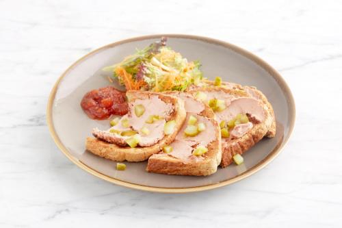 a plate of food with a sandwich and a salad at Holiday Inn Rochester-Chatham by IHG in Chatham