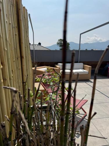 a fence with a bench and a plant at TIROLER TRIS modern villa 10 beds in Maurach
