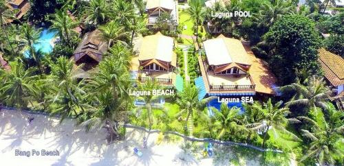 an aerial view of a resort on the beach at Luxurious Thai-Style Villa with a Swimming Pool Just 20 Meters from Beach Access in Ban Bang Po