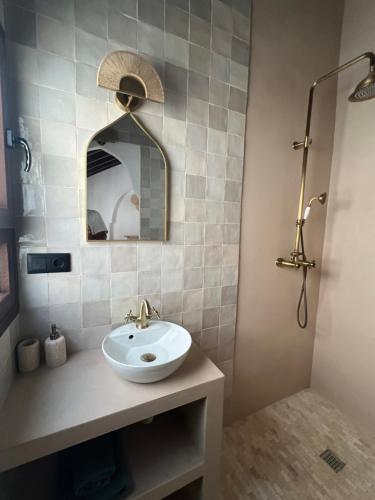 a bathroom with a sink and a shower at La Casa De Mama in Marbella