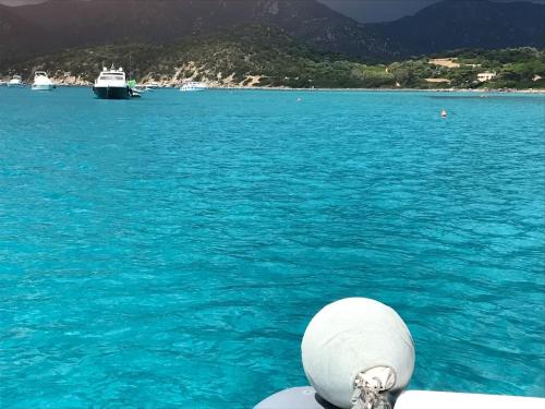 a view of the ocean from the bow of a boat at Beautiful luxury villa located in Sardinia in Villasimius near the beaches in Gesturi