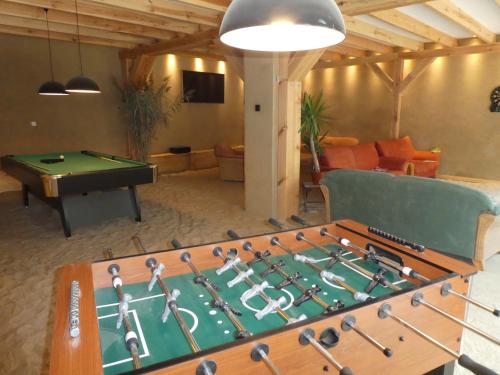 a large room with a pool table and a ping pong ball at Wochenend-Auszeit in Möckern