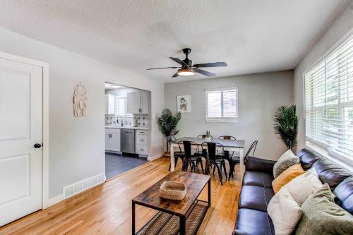 a living room with a couch and a table at Lovely family home in Northglenn with fenced yard and bonus room in Northglenn
