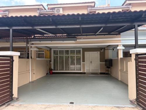 an empty patio of a house with awning at Putra Impiana Puchong in Puchong