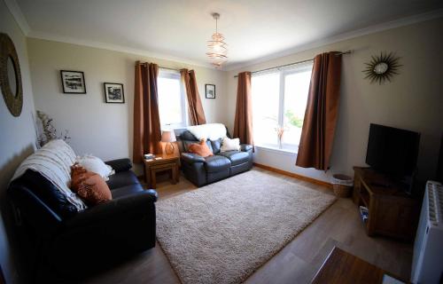 Μια τηλεόραση ή/και κέντρο ψυχαγωγίας στο Gairloch View Holiday Cottages