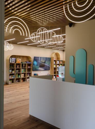 a library with a white counter in a room at Phoenix Medical Resort in Skhidnitsa