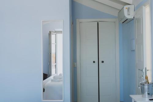 a bathroom with a white cabinet and a mirror at Vento d'Estate B&B in Portoscuso