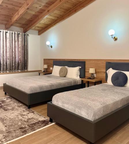 Postel nebo postele na pokoji v ubytování Mili Hotel