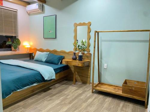 Ένα ή περισσότερα κρεβάτια σε δωμάτιο στο Rêu Home