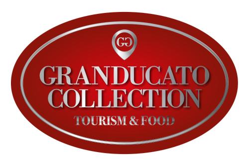 a red circle sign with the words grandidota colitis collection at VioVillas Agriturismo Glamping Arezzo in Arezzo