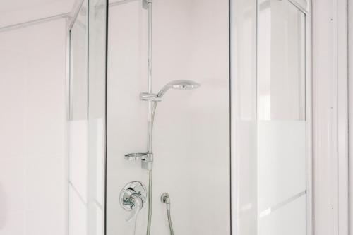 a shower in a bathroom with a glass door at Terrazza d'Amare - Alassio Centro in Alassio
