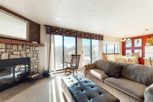 a living room with a couch and a fireplace at Buffalo Ridge 205 in Silverthorne