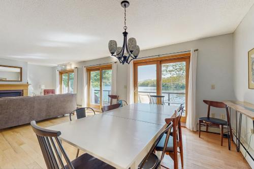 a dining room with a white table and chairs at Phillips Serenity Retreat in Dedham