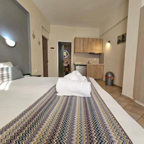Postel nebo postele na pokoji v ubytování Joanna Apartments