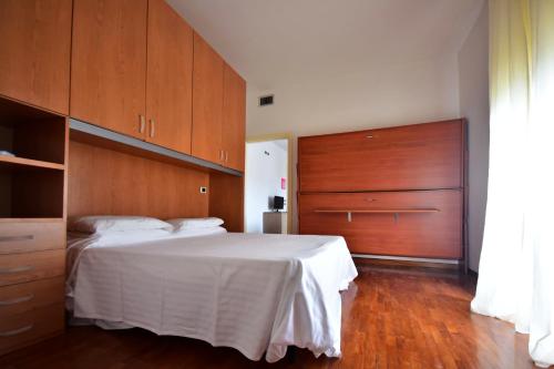 Säng eller sängar i ett rum på Residence Avana