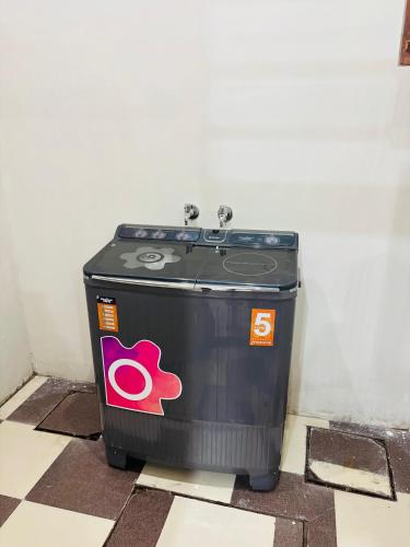 a trash can sitting on the floor in a room at 4BHK Luxury Villa In Mohali - Stay Royal in Kharar
