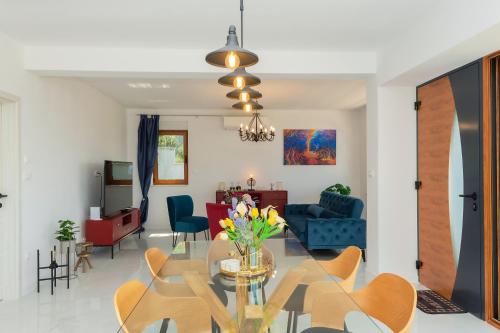 a living room with a table and chairs at Luxury Villa Dobri Dida in Imotski