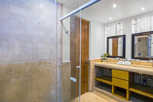 a bathroom with a shower and a sink at Nitta Condo 109 in Nuevo Vallarta 