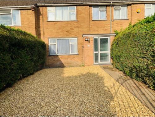 a brick house with a driveway in front of it at Surrey Hills Retreat - 2-Bed - Easy London Access in Ash
