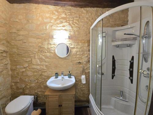 a bathroom with a sink and a shower at Gîte de charme en Dordogne avec piscine et jardin - FR-1-616-485 in Berbiguières