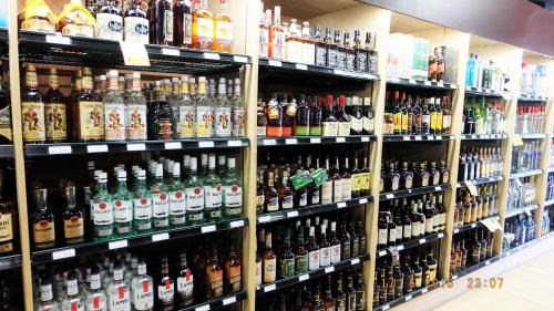 a store shelf filled with lots of bottles of alcohol at Pemberton Hotel (Motel) in Pemberton