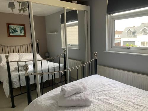 a bedroom with two bunk beds and a window at New Road Hideaway in Newton