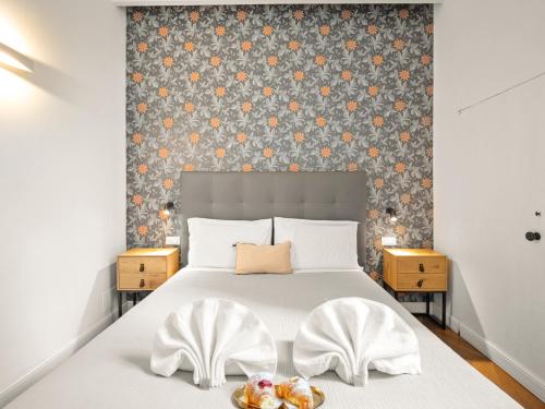 Ένα ή περισσότερα κρεβάτια σε δωμάτιο στο Four Season's Ghibellina Luxury Apartment 300 mt from Duomo