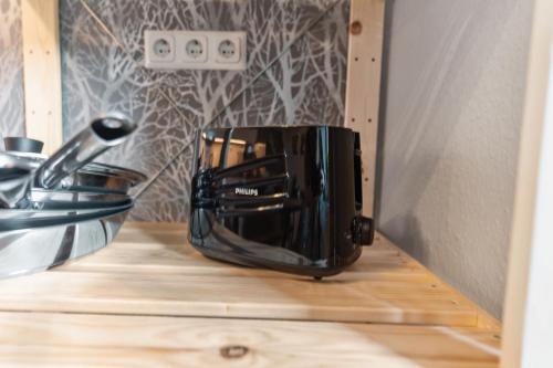 a toaster sitting on top of a kitchen counter at KERA STAY - Apartments Merseburg in Merseburg