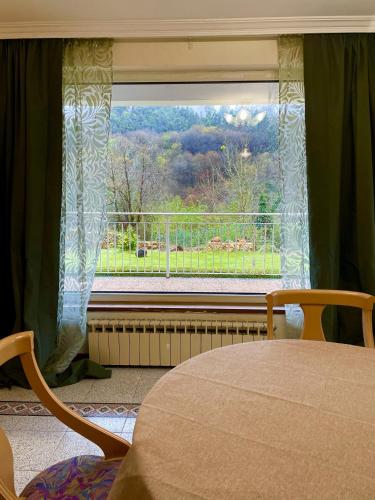 a bedroom with a window with a view of a balcony at Villa Eiros in Belandres