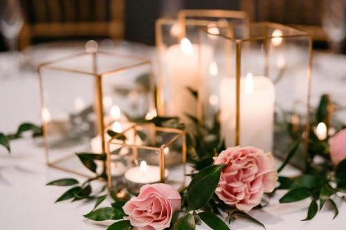 a table with candles and flowers on a table at Minneapolis Marriott City Center in Minneapolis