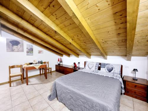 Postel nebo postele na pokoji v ubytování Camera Adamello 2