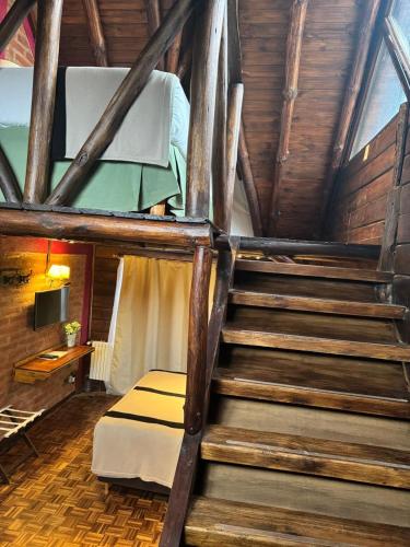 Postel nebo postele na pokoji v ubytování Hosteria Los Canelos
