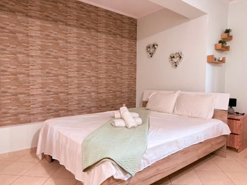 Ένα ή περισσότερα κρεβάτια σε δωμάτιο στο Eleni studio apartment Preveza