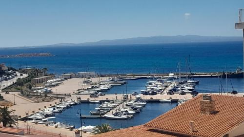 a bunch of boats are docked in a marina at B&B Nuovo Capo Altano in Portoscuso