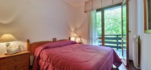 Ένα ή περισσότερα κρεβάτια σε δωμάτιο στο Nido IN montagna