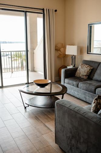 a living room with a couch and a coffee table at The Citrus Hotel in Tavares