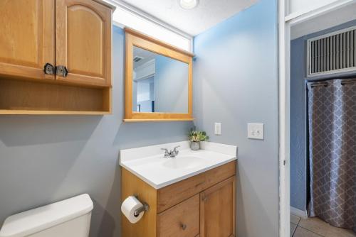 a bathroom with a sink and a toilet at Stay-Seas Hideaway 214 at Cedar Cove Condos in Cedar Key