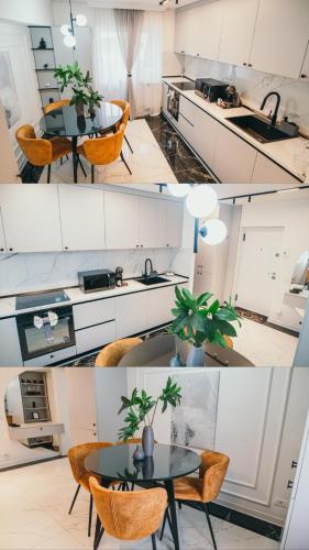 a kitchen with a table and chairs and a sink at Centru Est One in Drobeta-Turnu Severin