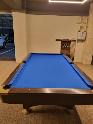 a large blue pool table in a parking lot at Brown Dot Hotel Sinan in Gwangju