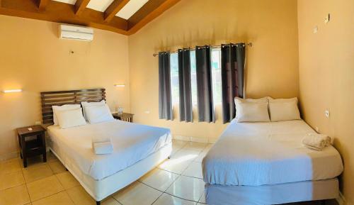 Кровать или кровати в номере Hotel El Encanto
