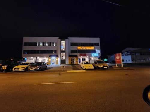 a parking lot with cars parked in front of a building at Base apartments ap 204 - Capital region of Reykjavík in Hafnarfjördur