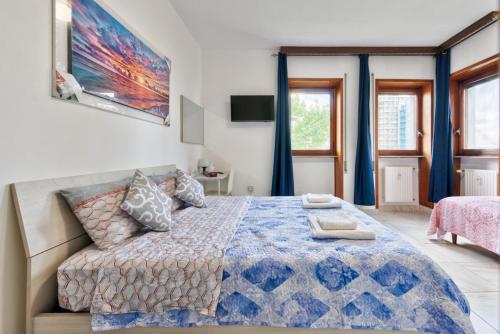 Katil atau katil-katil dalam bilik di Arish Downtown Venice Apartment