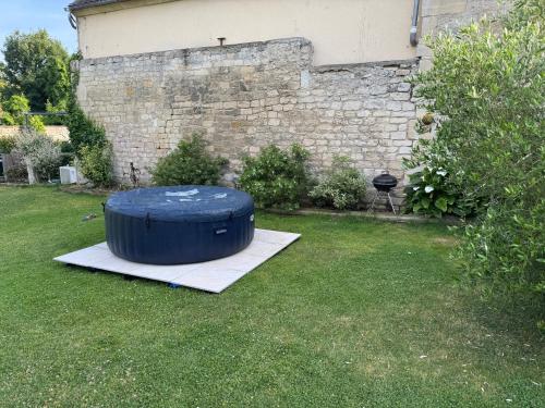 a blue barrel sitting on the grass in a yard at Gîte du fief in Cires-lès-Mello