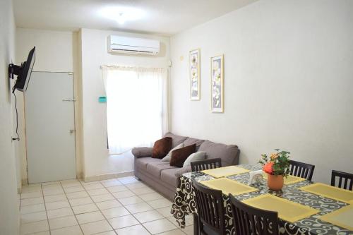 a living room with a couch and a table at House equipped with two bedrooms in La Paz