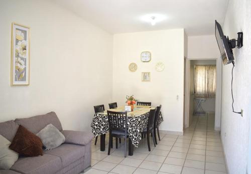 a living room with a table and a couch at House equipped with two bedrooms in La Paz