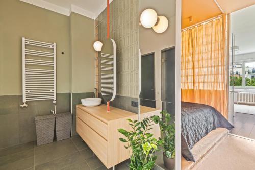 En eller flere senge i et værelse på Parkview Residence Bliss