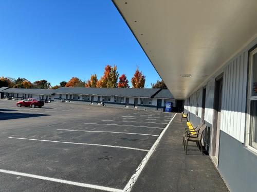 an empty parking lot with chairs in a building at Glengarry Extended Stays in Truro