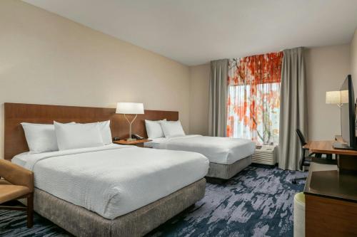 a hotel room with two beds and a window at Fairfield Inn & Suites by Marriott Twin Falls in Twin Falls