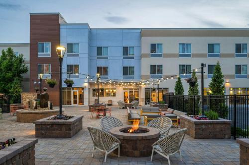 a courtyard with chairs and a fire pit in front of a building at Fairfield Inn & Suites by Marriott Twin Falls in Twin Falls